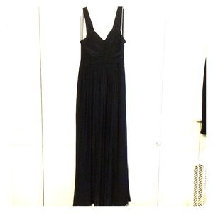 Floor length black evening dress.